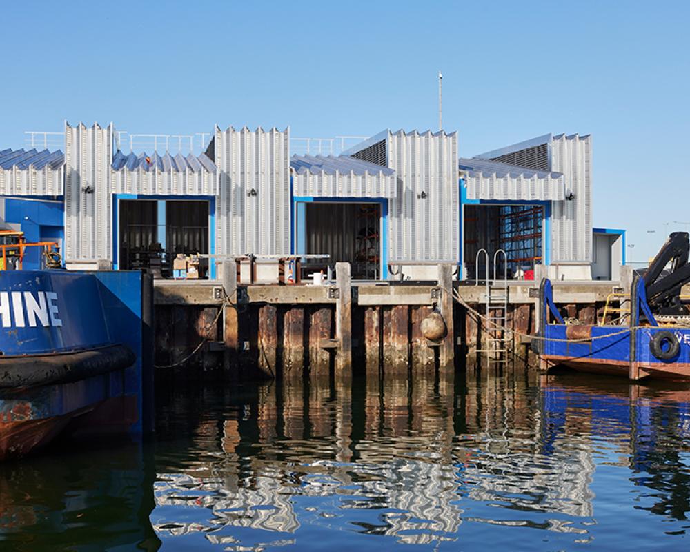 Contemporary architectural roofing with ARAMAX® profile in Port Melbourne mixed-use project.