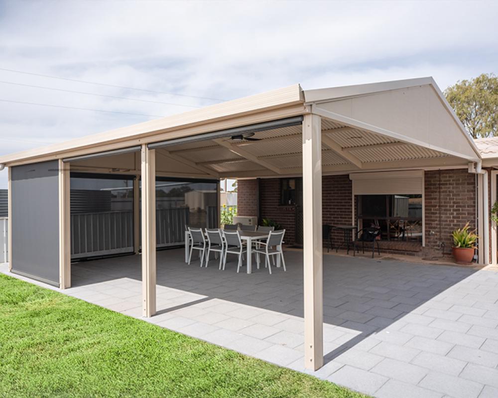 : Covered patio with pull-down blinds, tiled floor and COLORBOND® steel roof.