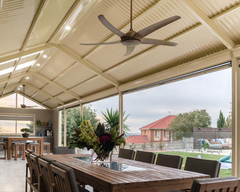 Modern COLORBOND® steel patio with ceiling fan and natural light for year-round comfort