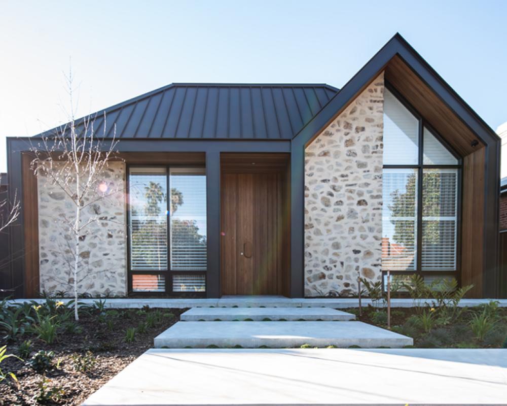 Residential home with pitched roof and COLORBOND® steel roofing, illustrating balanced roofing colour selection 