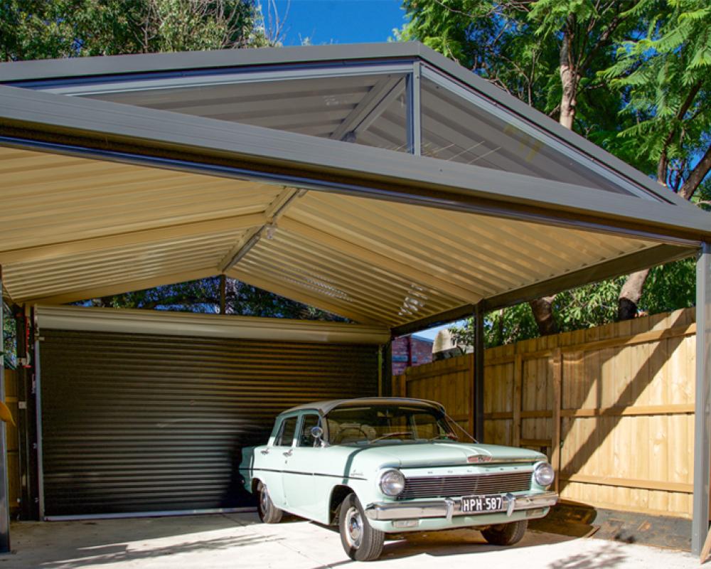 Free-standing double carport with a gable roof and rear roller door, a larger option among custom carport designs