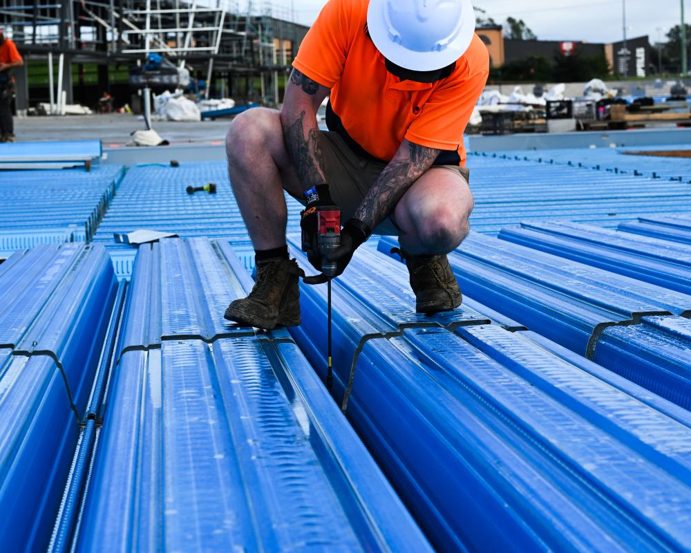 Installer installing SlimDek210 at Strathpine