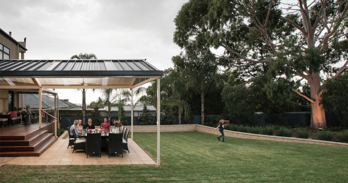 Patio designed for indoor-outdoor living with outdoor dining area and seamless connection to the backyard