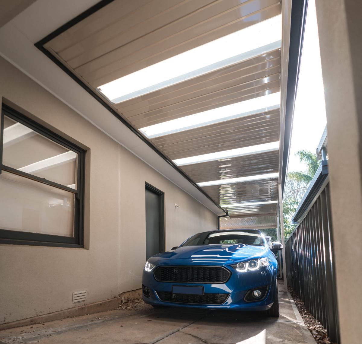 A photo of a car safely parked under a Fielders carport