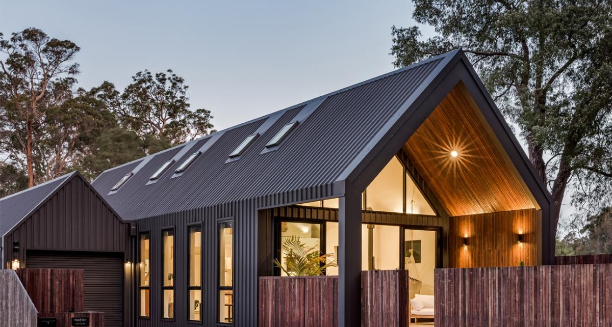 Modern home with dark COLORBOND® steel roofing and wall cladding, showing how roofing colour defines contemporary design