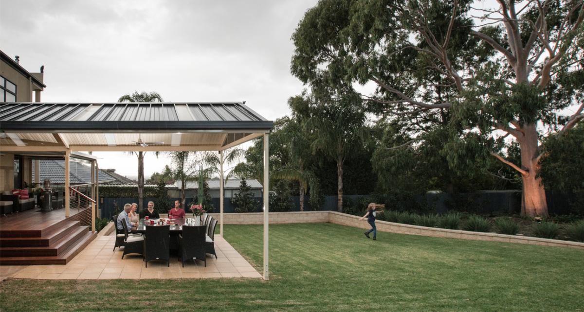 Patio designed for indoor-outdoor living with outdoor dining area and seamless connection to the backyard