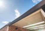 Underside of a steel awning against blue sky, illustrating how COLORBOND colours read differently in full Australian sunlight