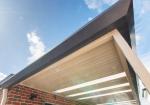 Underside of a steel awning against blue sky, illustrating how COLORBOND colours read differently in full Australian sunlight