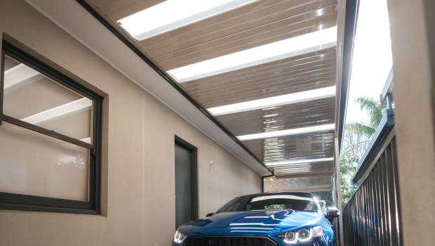 A photo of a car safely parked under a Fielders carport