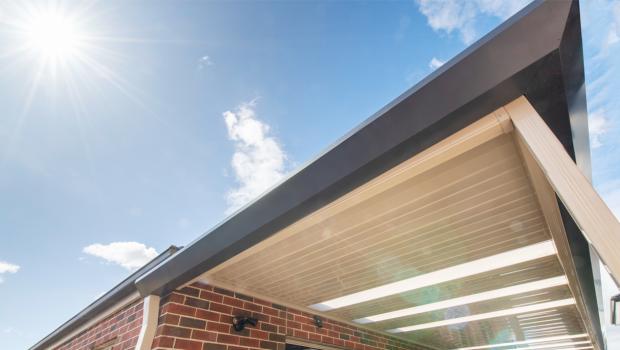 Underside of a steel awning against blue sky, illustrating how COLORBOND colours read differently in full Australian sunlight