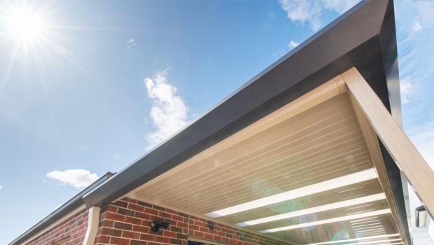 Underside of a steel awning against blue sky, illustrating how COLORBOND colours read differently in full Australian sunlight