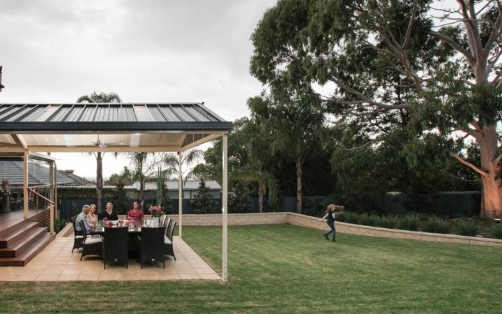 Patio designed for indoor-outdoor living with outdoor dining area and seamless connection to the backyard